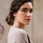 A beautiful woman with a twisted low bun hairstyle