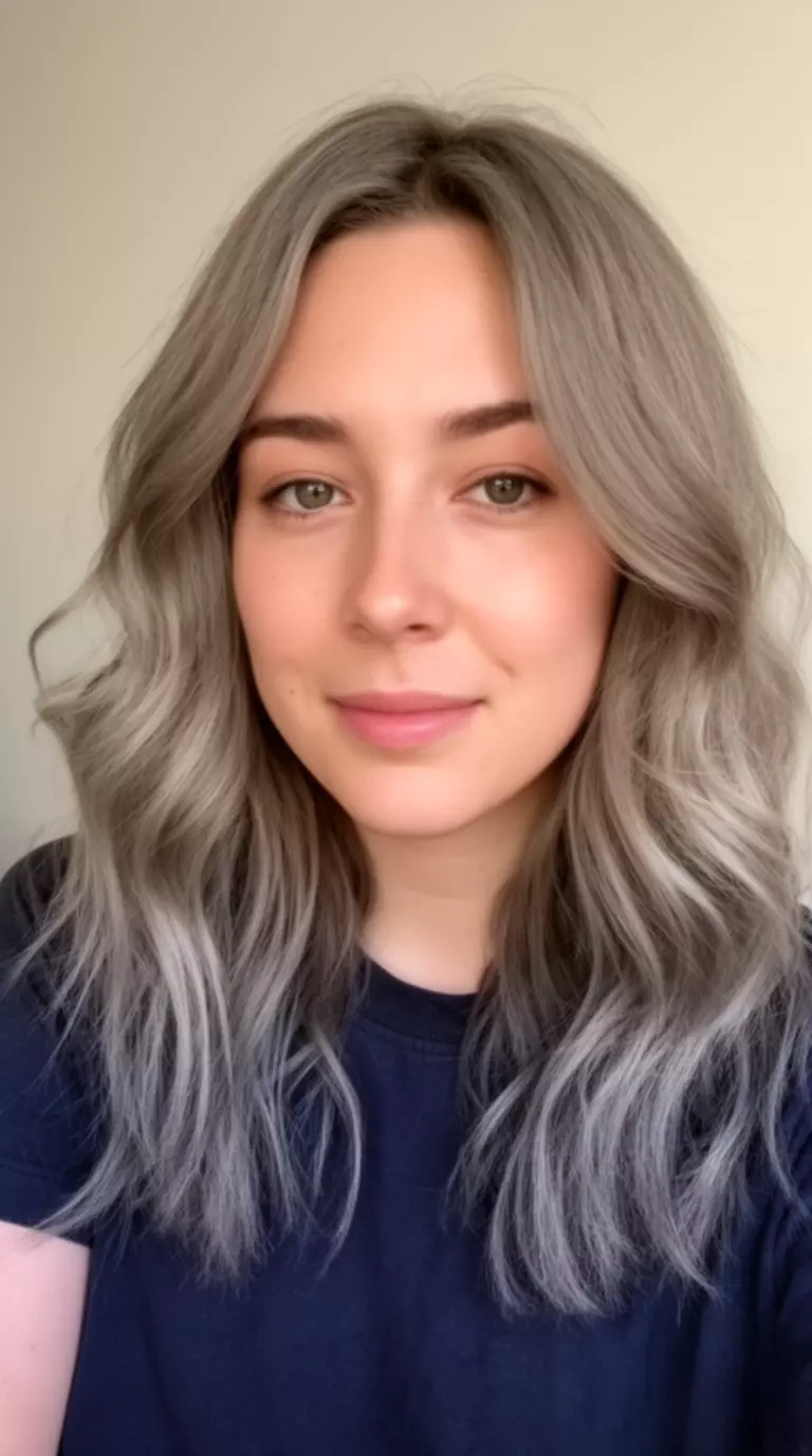 casual close-up photo of a 31-year-old woman wearing a dark top with a Ashy Mushroom colored medium-length wavy hairstyle, front view, minimal background