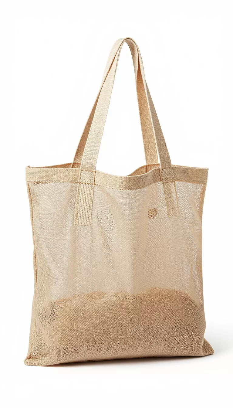 A light brown natural colored mesh beach tote bag with matching woven straps designed for maximum airflow, showing a semi transparent texture perfect for carrying wet towels.