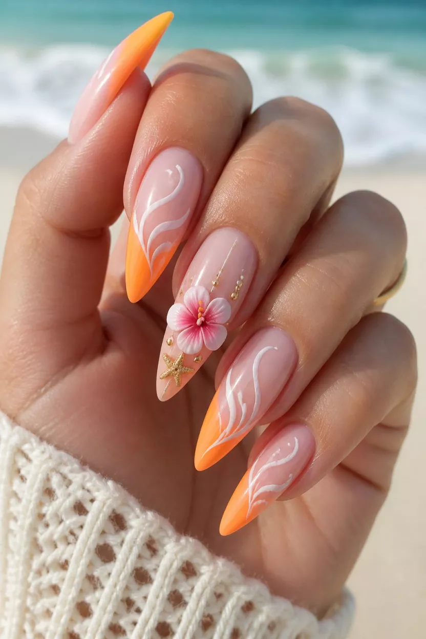 close-up shot of a woman’s hand with five fingers showing long stiletto nails with bright orange ombre tips, white swirling lines, and a 3D pink hibiscus flower with a starfish decoration